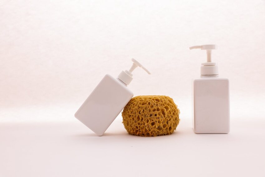 white dispenser pumps and brown sponge