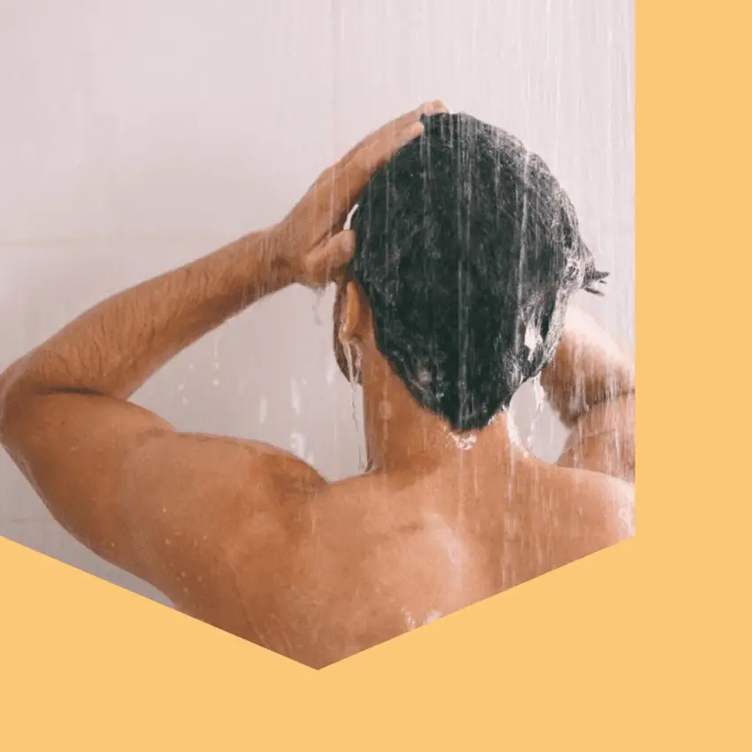 man washing his hair with seborrheic dermatitis shampoo to remove flakes dandruff