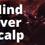 File:Bedik hairstyling, Iwol, southeast Senegal (West Africa) (989178952).jpg - a man with a red ban