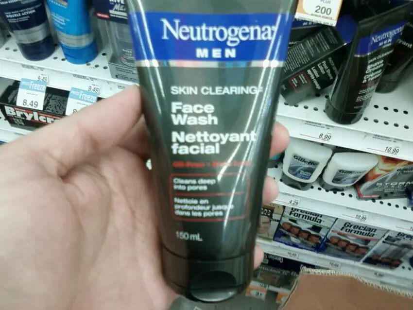 Neutrogena Men Skin Clearing Face Wash - a hand holding a tube of face wash