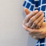 close up senior woman massage on hand to relief pain from hard working for treatment about carpal tu