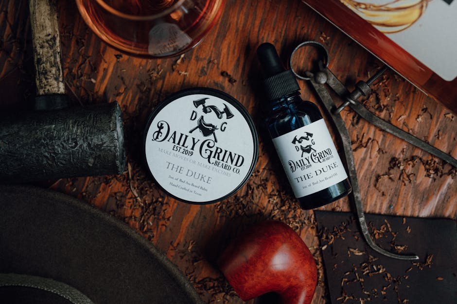 10 Best Beard Oils for Seborrheic Dermatitis in 2023: Our Top Picks - Detailed rustic flat lay of Daily Grind beard balm and oil on wooden surface.