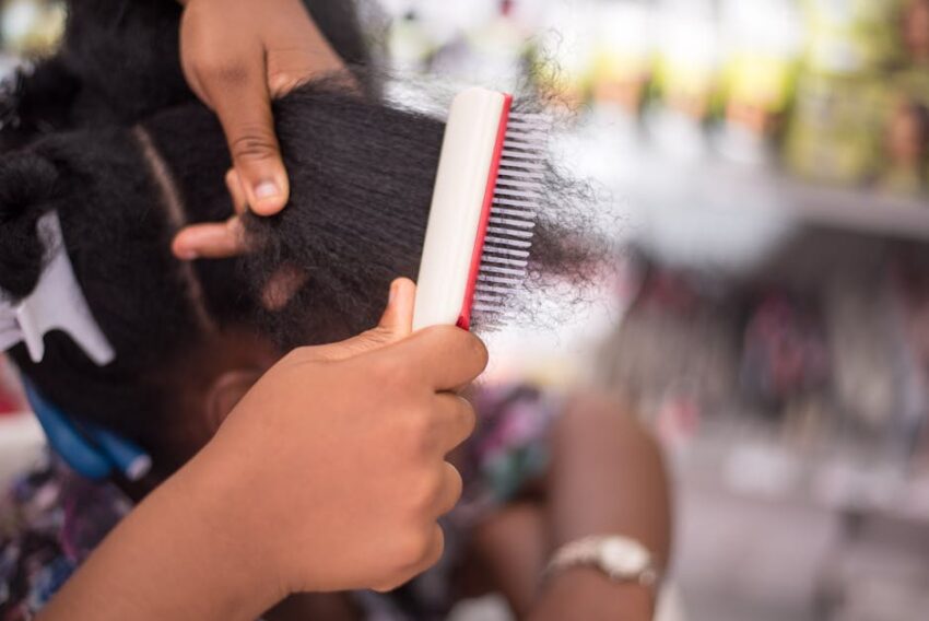 Best Conditioner for Seborrheic Dermatitis 2026: Top Picks for Scalp Relief 4 Best Conditioner for Seborrheic Dermatitis 2026: Top Picks for Scalp Relief - Detailed close-up of a person combing afro hair, showcasing hair care and styling techniques.