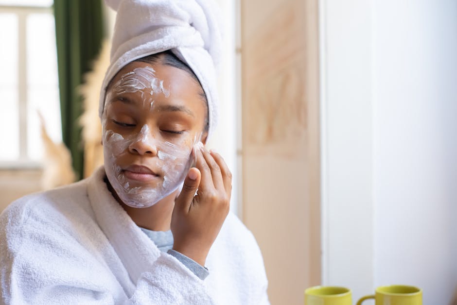 Best Seborrheic Dermatitis Face Washes 2026 | SebDermatology - A teenage girl applies facial cream as part of her skincare routine in a cozy indoor setting.
