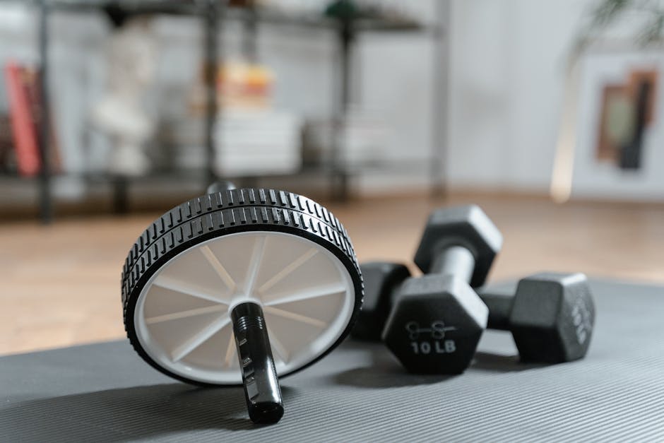 Best Sweat-Wicking Products for Seborrheic Dermatitis in Summer 2026 - Ab roller and dumbbells on yoga mat, perfect for a home workout routine and healthy lifestyle.