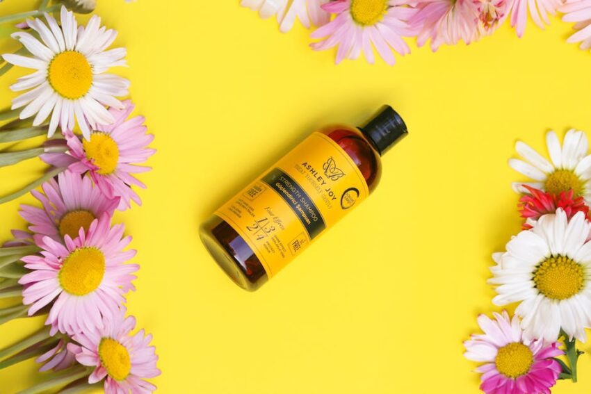 DHS Tar Shampoo: An Effective Solution for Seborrheic Dermatitis 1 DHS Tar Shampoo: An Effective Solution for Seborrheic Dermatitis - A vibrant yellow shampoo bottle surrounded by fresh daisy flowers on a bright background.