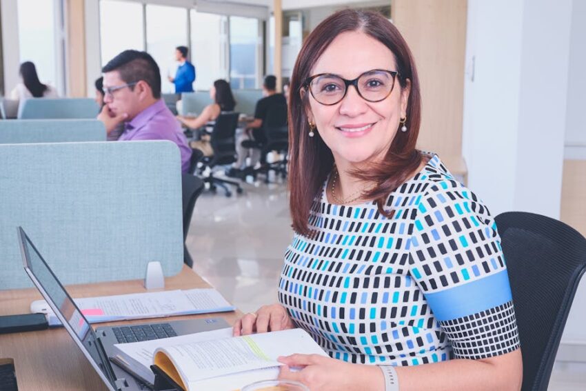 Hypochlorous Acid Spray for Seborrheic Dermatitis: Does It Work? (2026 Guide) 4 Hypochlorous Acid Spray for Seborrheic Dermatitis: Does It Work? (2026 Guide) - Confident woman in a modern office, surrounded by colleagues, working on a laptop.