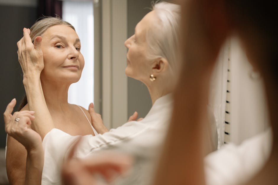 Managing Seborrheic Dermatitis in Aging Individuals: Expert Tips - Chic elderly woman applying makeup, embracing beauty and confidence at any age.