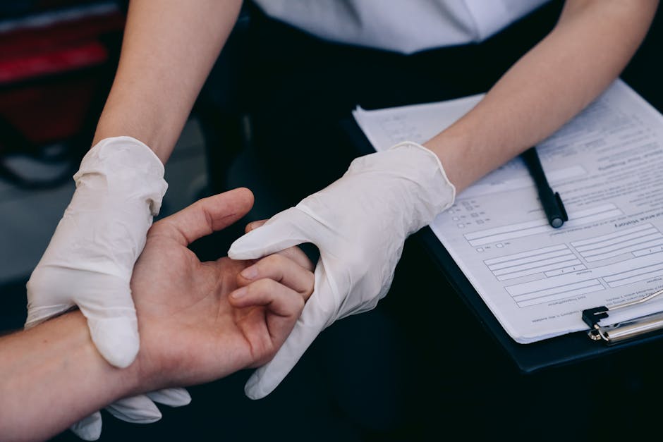 Neutrogena T/Gel & T/Sal: Complete Guide for Seborrheic Dermatitis 2026 - A healthcare worker wearing gloves examines a patient's hand during a medical procedure.