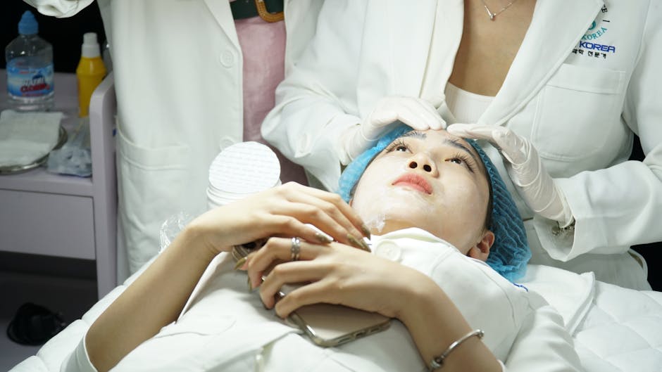 Neutrogena T/Gel & T/Sal: Complete Guide for Seborrheic Dermatitis 2026 - A woman receives a facial treatment at a skincare clinic, attended by specialists.