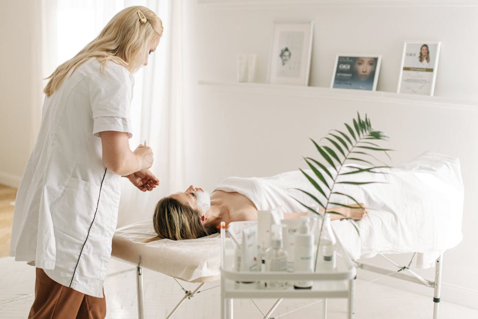 Seborrheic Dermatitis and Stress Management: Breaking the Flare Cycle (2026) - A serene spa setting featuring a facial treatment with a professional beautician, highlighting relaxation and skincare.