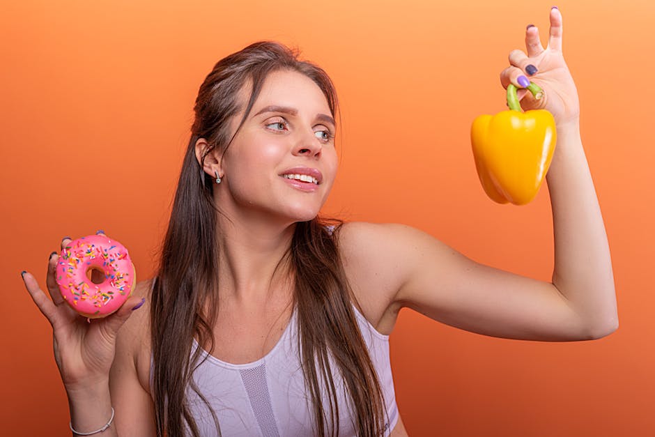 Seborrheic Dermatitis Diet Guide: Foods That May Help and What to Avoid (2026) - Woman in sports bra juggling choice between a donut and bell pepper on orange background.
