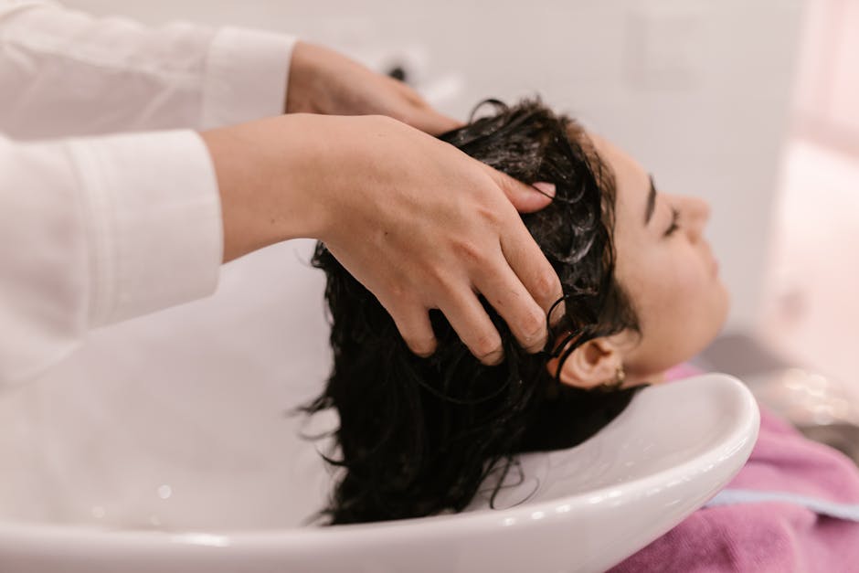 Seborrheic Dermatitis Hair Loss Treatment & Regrowth Guide 2026: Effective Solutions 18 Seborrheic Dermatitis Hair Loss Treatment & Regrowth Guide 2026: Effective Solutions - A woman enjoys a relaxing hair wash at a salon. Captured in a cozy indoor setting.