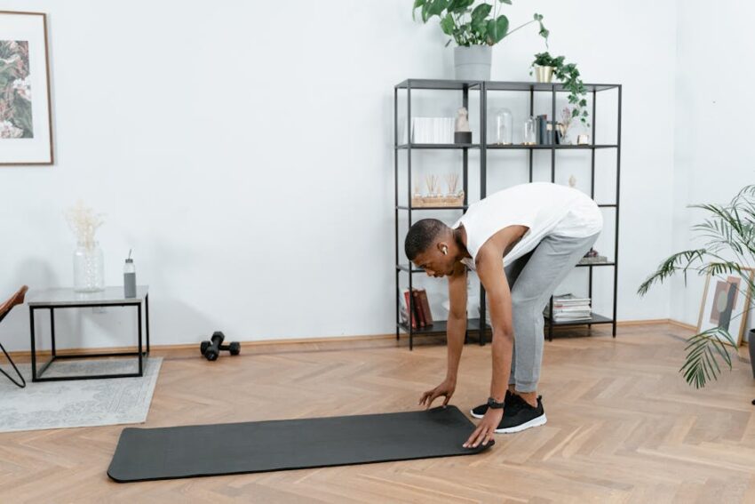 Can Exercise Prevent Seborrheic Dermatitis? What the 2026 Research Shows 1 Can Exercise Prevent Seborrheic Dermatitis? What the 2026 Research Shows - Black man practicing yoga indoors with mat, promoting healthy lifestyle and body care.