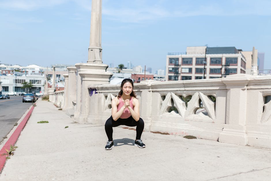 Can Exercise Prevent Seborrheic Dermatitis? What 2026 Research Reveals - Woman exercising outdoors, performing squats on a city sidewalk.