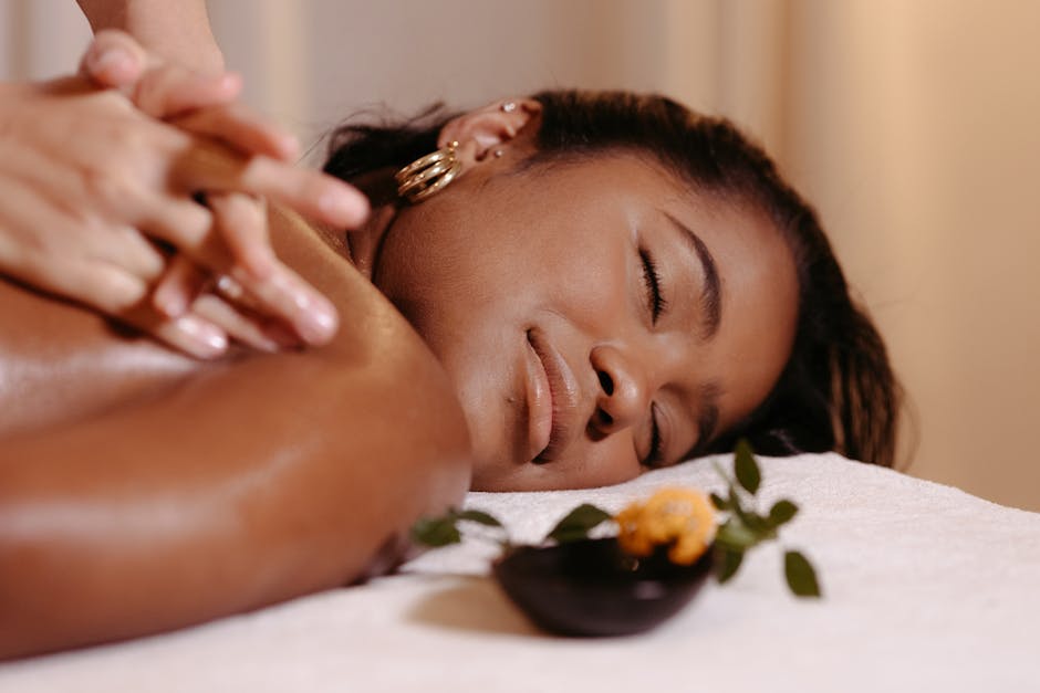 dermstore-premium-seb-derm-routine - A woman with closed eyes enjoying a relaxing massage and aromatherapy treatment.