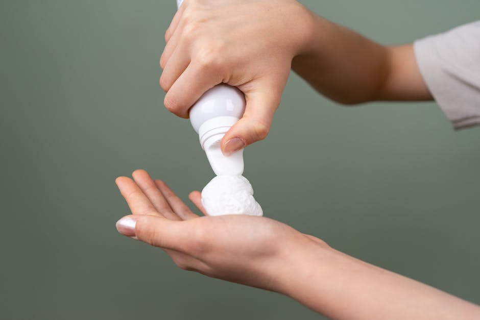 pde4-inhibitors-seborrheic-dermatitis-roflumilast-zoryve-2026 - Preparing shaving foam from dispenser for grooming close-up.