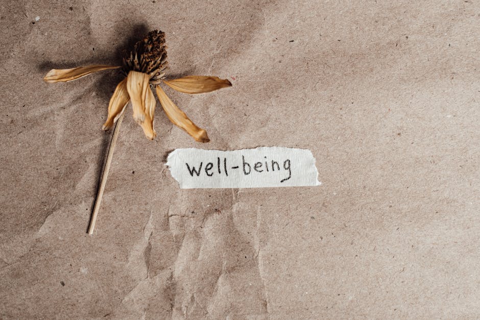 seb-derm-vs-demodex-mites-2026 - A dried flower beside a handwritten well-being note on brown paper, evoking calmness and reflection.