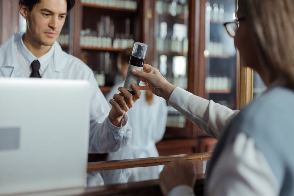 Seborrheic Dermatitis or Dry Scalp? How to Tell the Difference Before You Buy Another Shampoo (2026) - A pharmacist in a white uniform hands medication to a customer across the counter.
